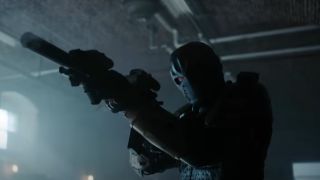 Zombie Deathstroke firing machine gun in Titans