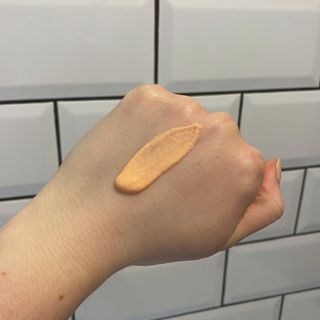Lucy with a swatch of NARS Radiance Primer SPF 35/PA+++ on the back of her hand