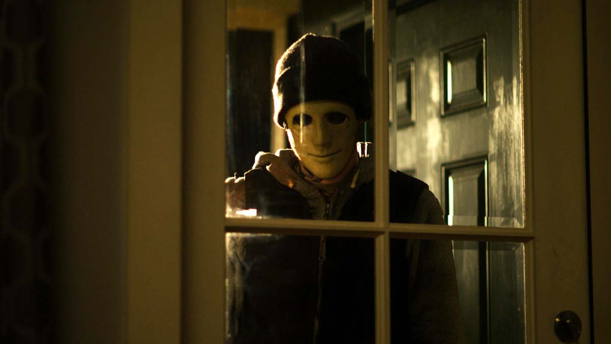 a masked creep in Hush, one of the best horror movies on netflix