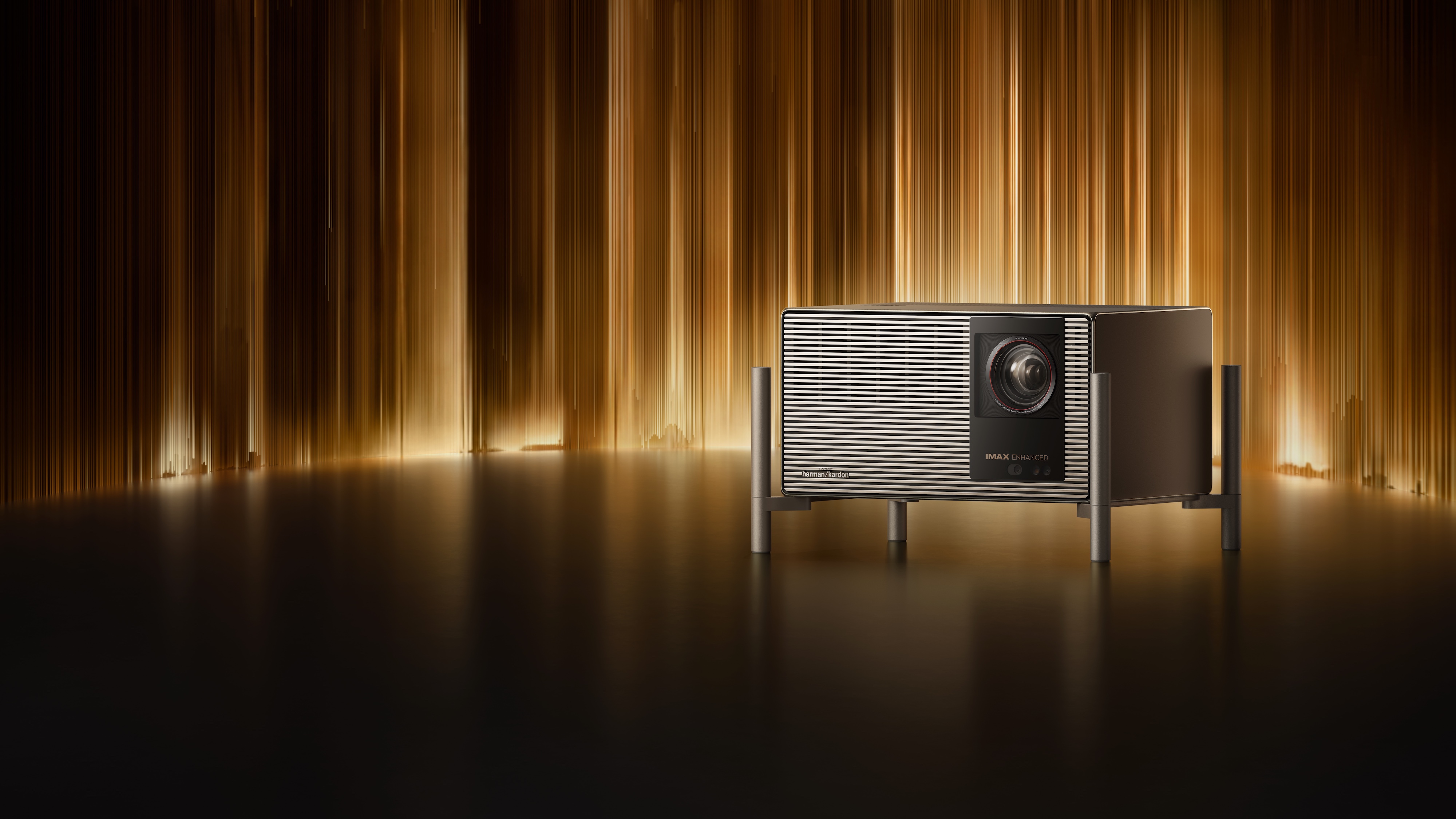 The XGIMI TITAN Noir Max projector in front of a stage curtain.