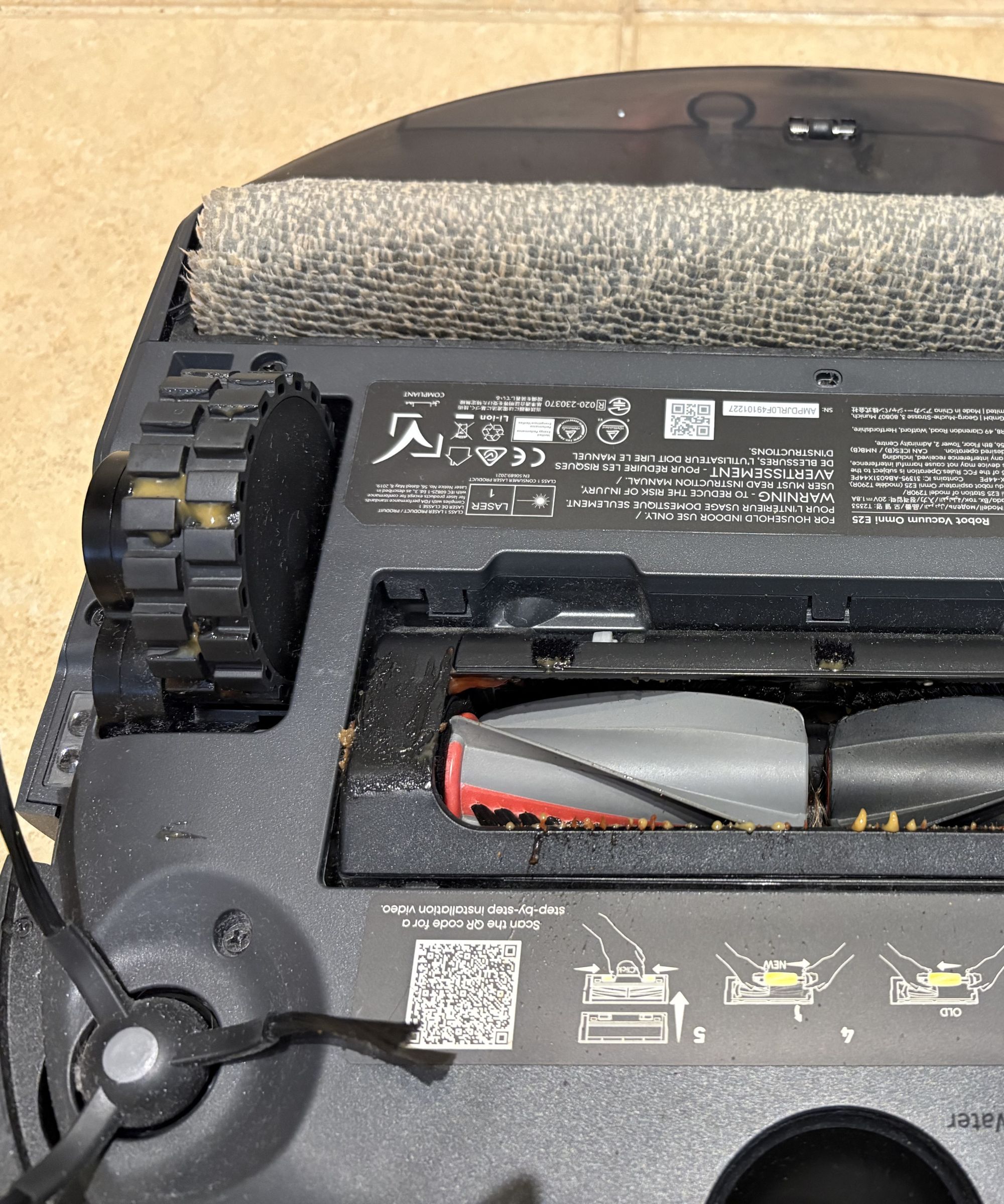 mustard and ketchup residue on the bottom of the eufy Omni E25 robot vacuum