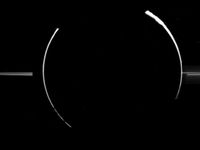 An eclipse of the sun by Jupiter, as viewed from Galileo, reveals the rings. Small dust particles high in Jupiter's atmosphere, as well as the dust particles that compose the rings, can be seen by reflected sunlight.