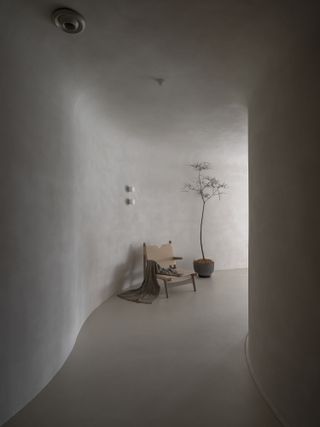 Entrance of Soul Realm Spa House in Hangzhou, China with white curving walls