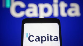 Capita logo displayed in front of a Capita sign