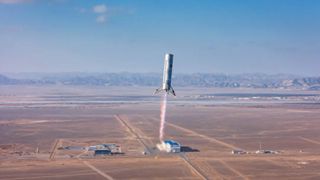 a small silver rocket rises into a blue sky above a desert landscape, trailing a pillar of flame
