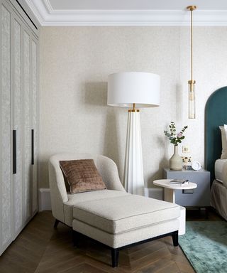 Mayfair apartment bedroom with armchair and lamp