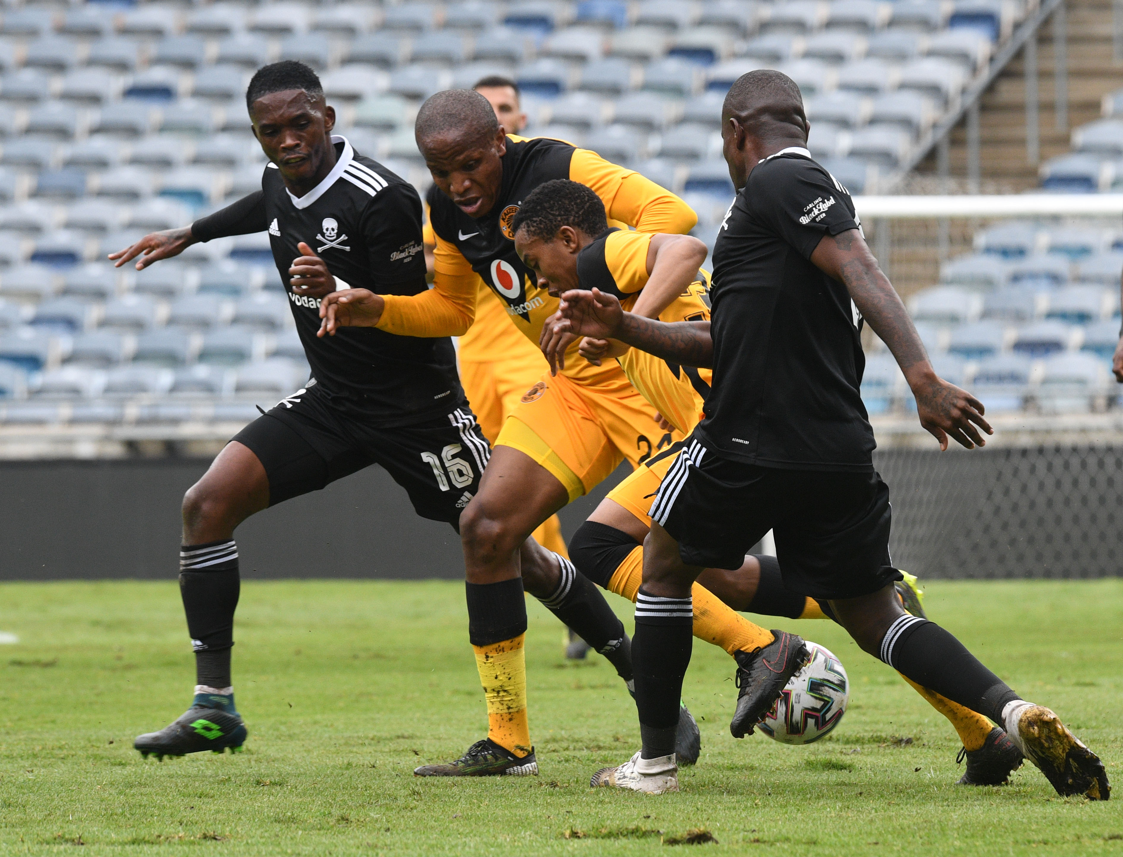 Nkosingiphile Ngcobo of Kaizer Chiefs challenges Ntsikelelo Nyauza of Orlando Pirates