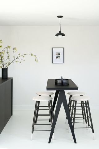 a small dining room in a modern cottage