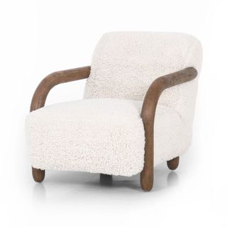 A shearling chair with wooden arms