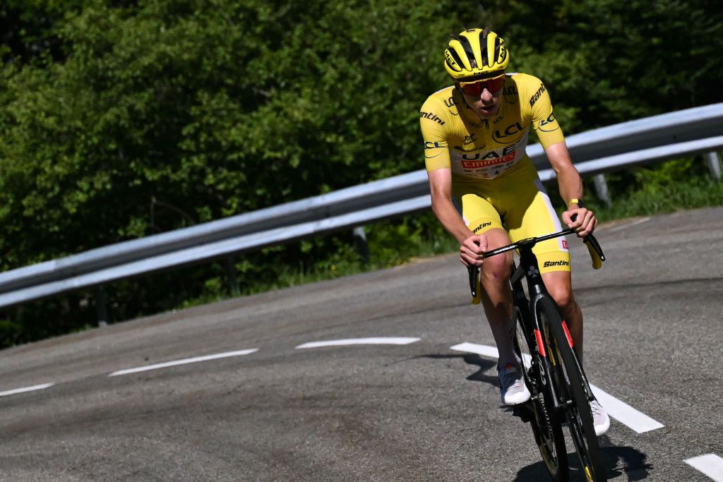 UAE Team Emirates team&#039;s Slovenian rider Tadej Pogacar wearing the overall leader&#039;s yellow jersey cycles in the final ascent of the Plateau de Beille during the 15th stage of the 111th edition of the Tour de France cycling race, 197,7 km between Loudenvielle and Plateau de Beille, in the Pyrenees mountains, southwestern France, on July 14, 2024. (Photo by Marco BERTORELLO / AFP)