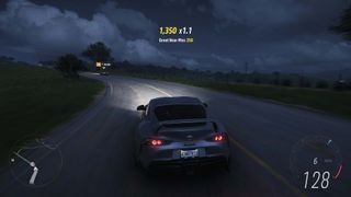 A screenshot from Forza Horizon 5 showing a Toyota on the road at night