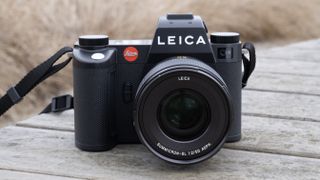 The Leica SL3 camera sat on a wooden bench