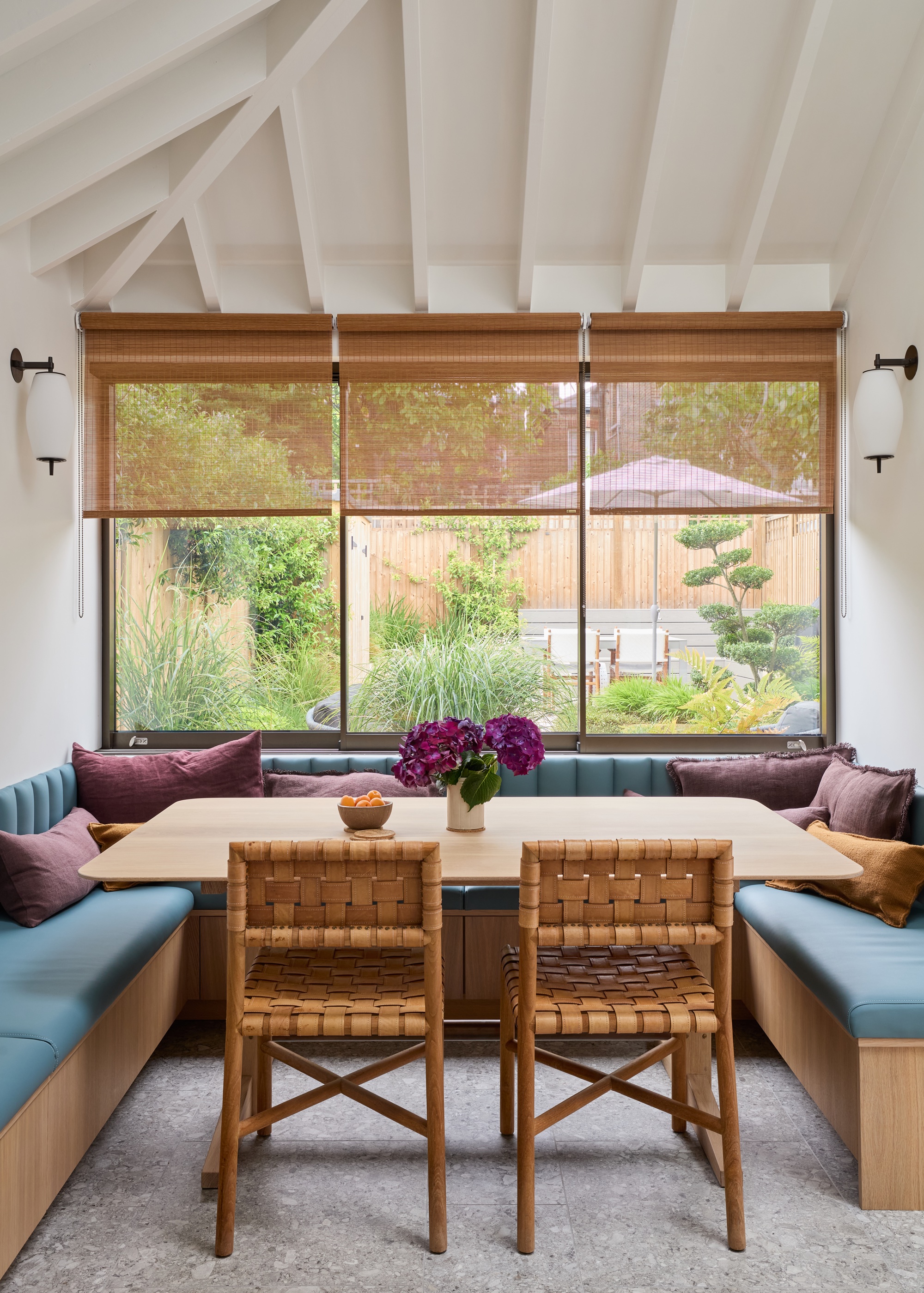 breakfast nook with banqette seating in white kitchen