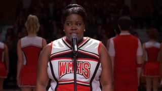Amber Riley singing in Glee.