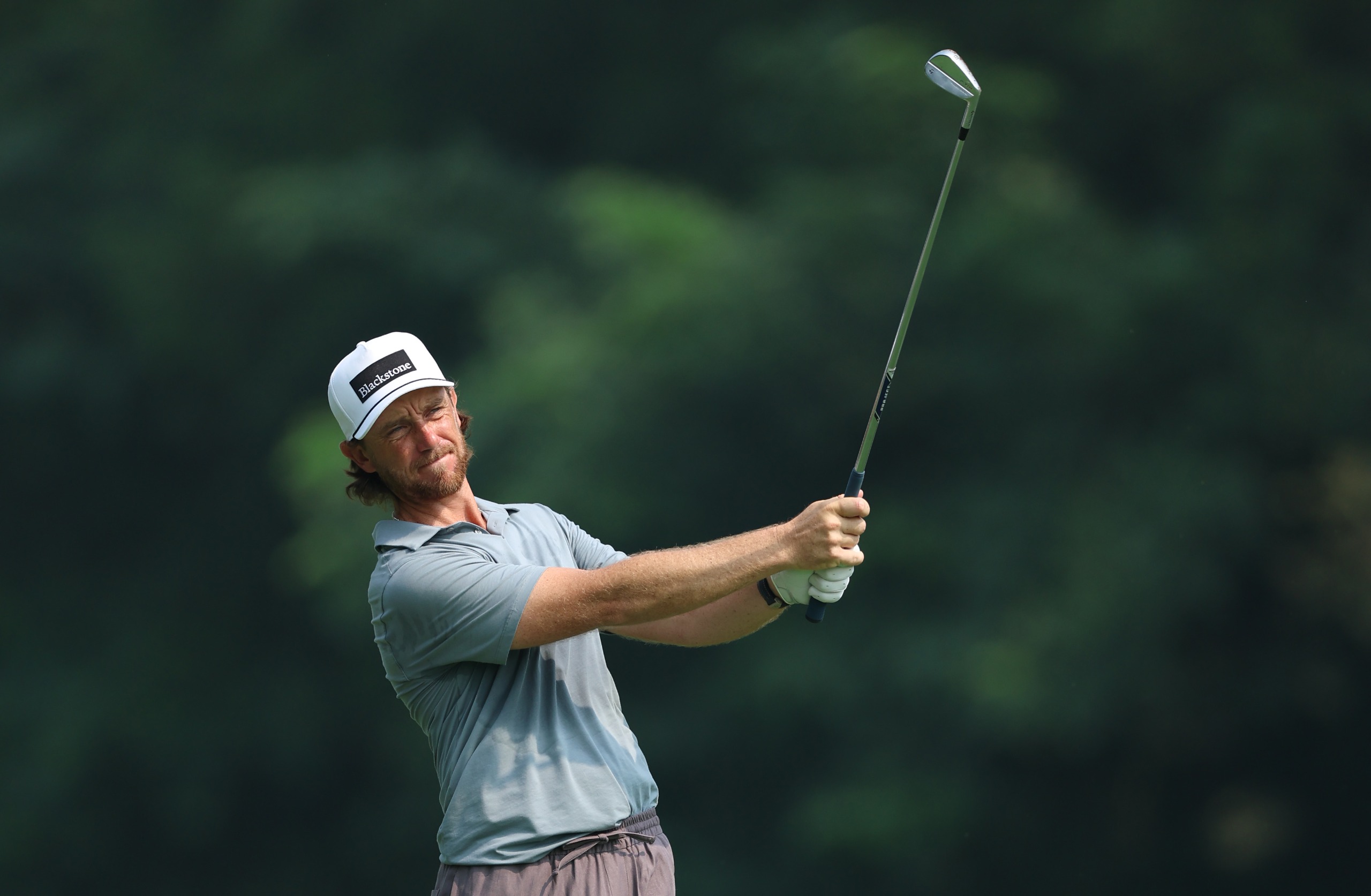 Tommy Fleetwood holds his finish on an iron shot