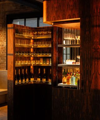 Wood bar cabinet hidden inside a cupboard