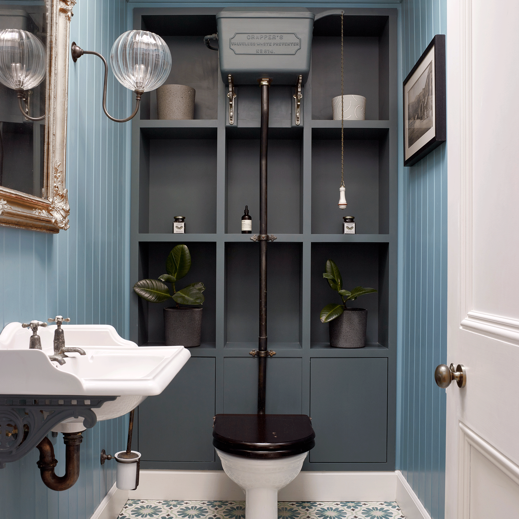 Blue bathroom with black toilet