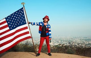 Keith Lemon waves US flag in America