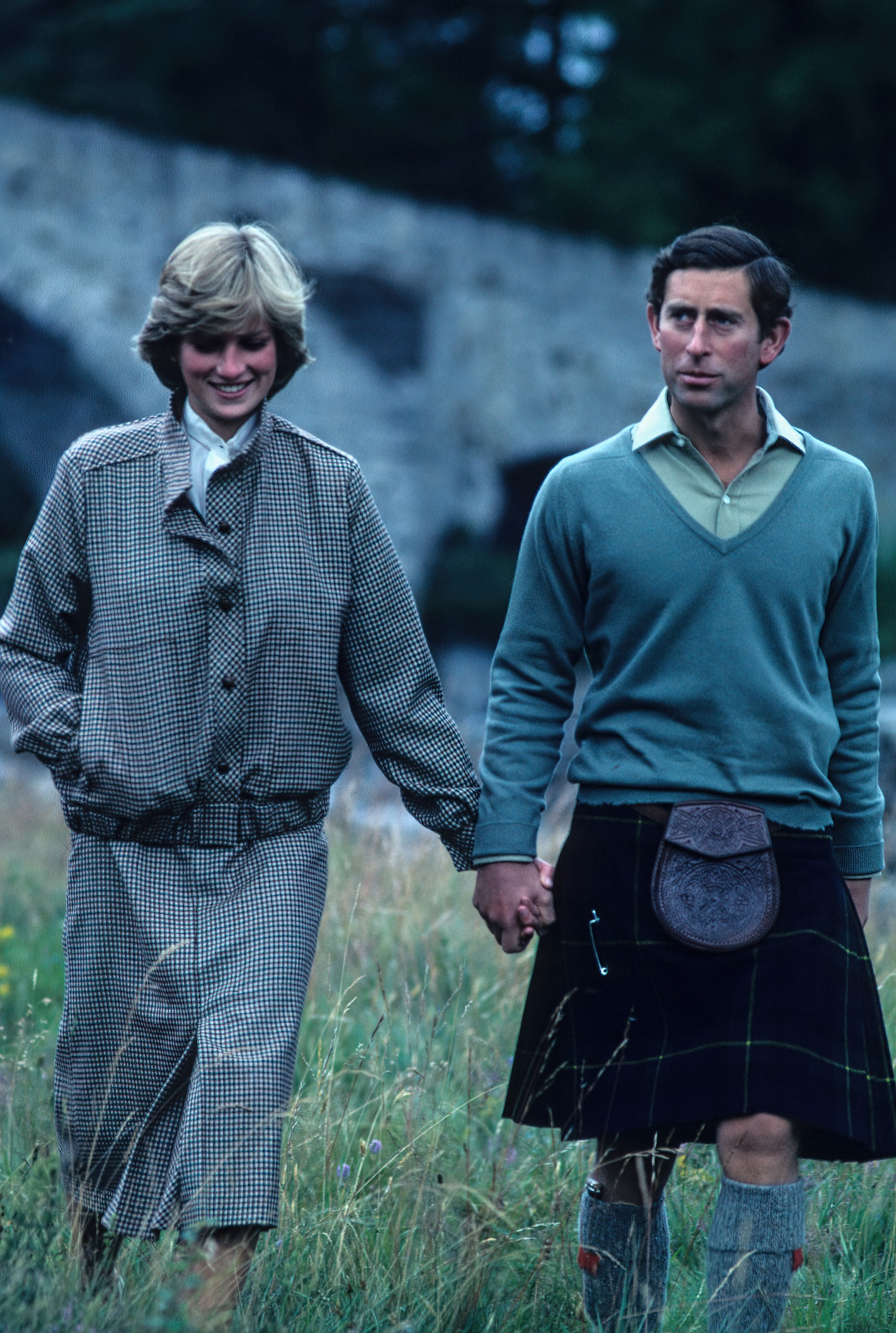 Princess Diana holding hands and walking with Prince Charles at Balmoral