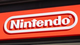 Close-up of Nintendo logo on red storefront sign.
