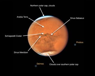 This image of Mars, taken by the Hubble Space Telescope, is labeled to show the many features of the Red Planet which are difficult to see because of the global dust storm.