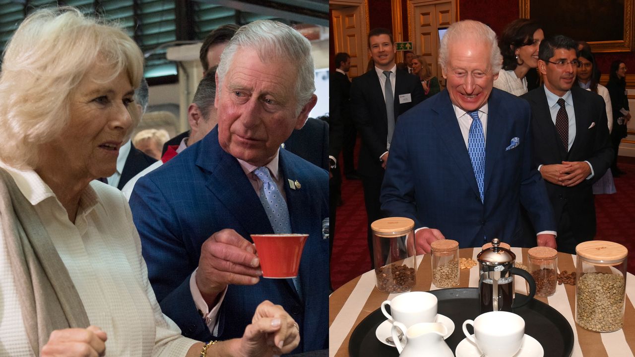 King Charles sitting at a counter and wearing a blue suit and tie holding a red mug up to Queen Camilla next to a picture of The King in a blue suit and tie standing and laughing in front of a table filled with cups, suacers and coffee supplies.