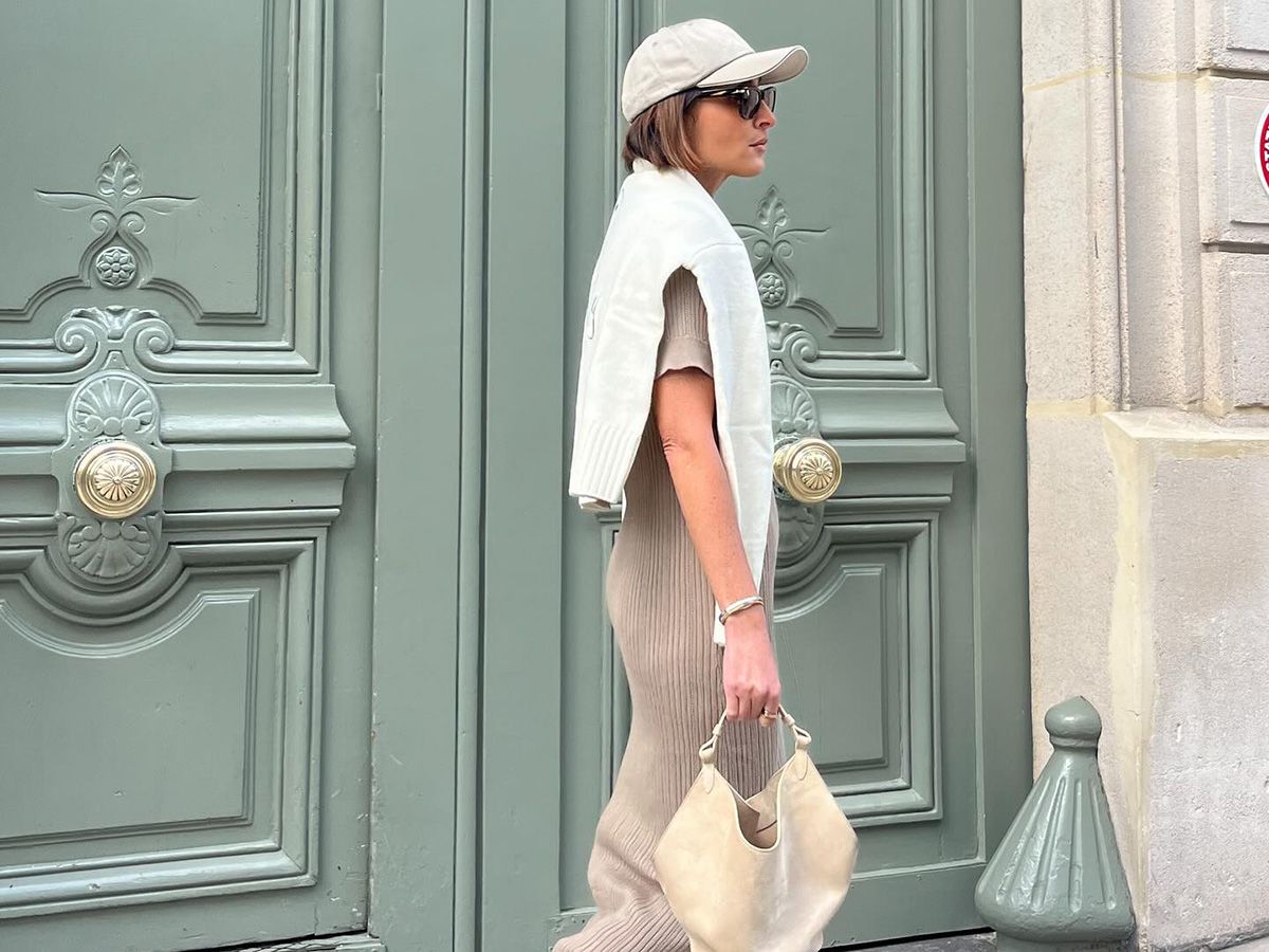 Woman wearing a baseball cap on a street in Paris