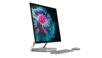A Microsoft Surface Studio 2 with a mouse and keyboard against a white background