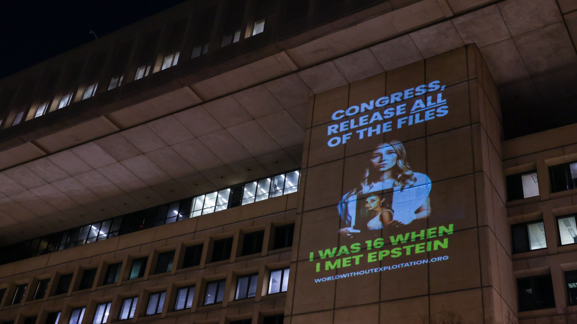 A projection of an Epstein survivor is seen on the FBI building in Washington, D.C. 