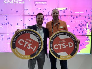 Luke Jordan and Jeremy Caldera celebrate CTS holders at InfoComm 2019.