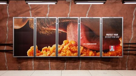 body part touching chicken on billboard