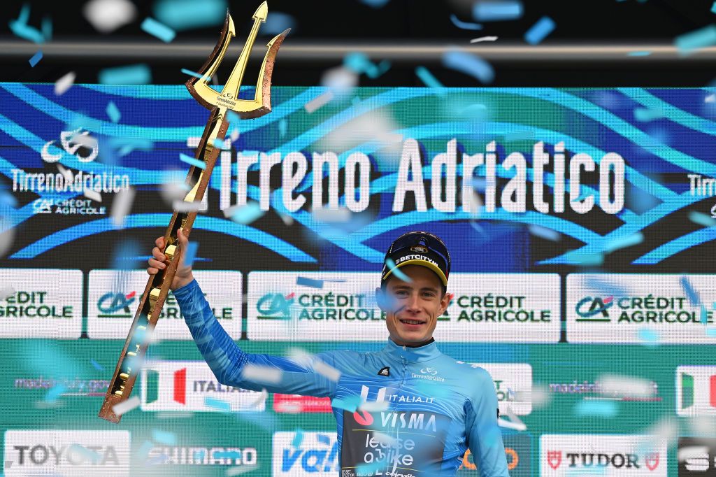 SAN BENEDETTO DEL TRONTO ITALY MARCH 10 Jonas Vingegaard Hansen of Denmark and Team VismaLease A Bike celebrates at podium as race winner and Blue Leader Jersey with Trident Race Trophy during the 59th TirrenoAdriatico 2024 Stage 7 a 154km stage from San Benedetto del Tronto to San Benedetto del Tronto UCIWT on March 10 2024 in San Benedetto del Tronto Italy Photo by Tim de WaeleGetty Images