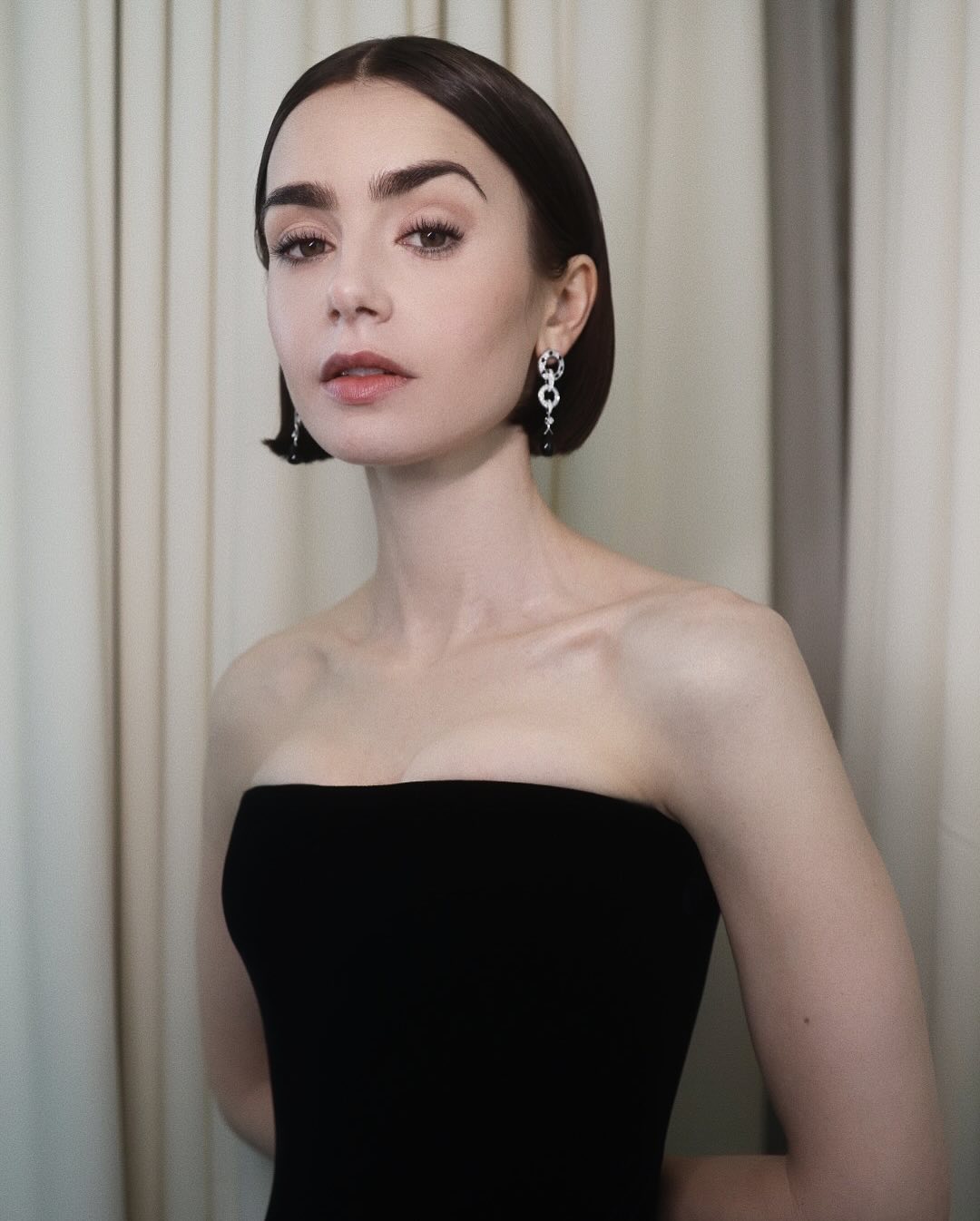 Lily Collins with blunt disciplined bob