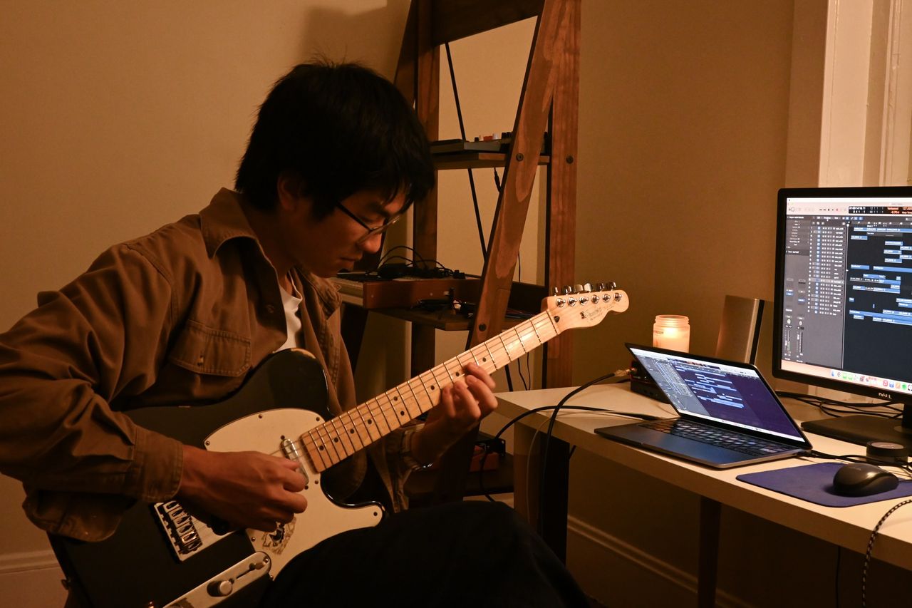 Flawed Mangoes playing a fender tele in a studio setup