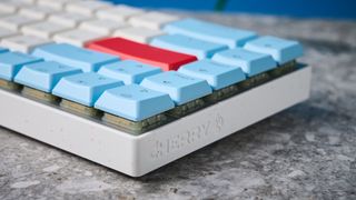 A Cherry MX LP 2.1 low-profile keyboard with red, white and blue keycaps