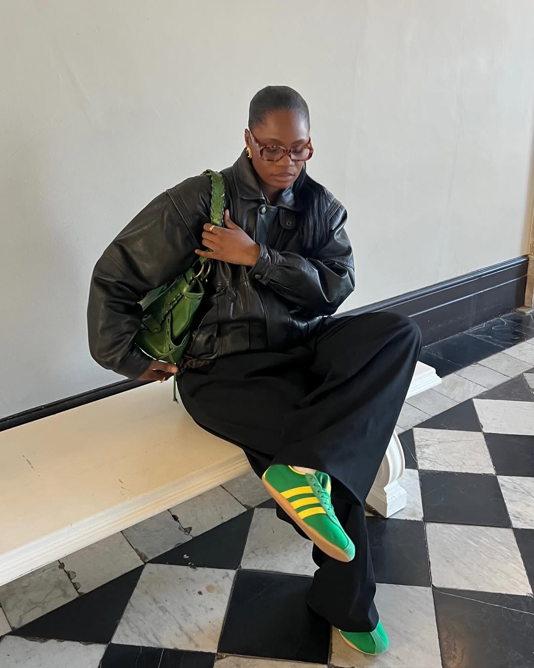 An influencer wearing adidas sneakers.