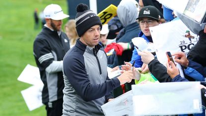 Rory McIlroy signs autographs during a practice round at the 2019 US PGA Championship