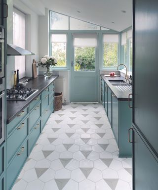 Galley kitchen with gray and white tiles