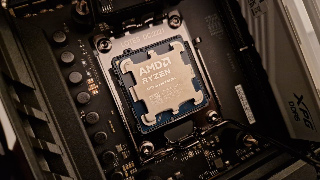 An AMD Ryzen 7 8700G seated on a motherboard