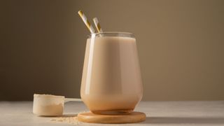 Protein shake with golden straw