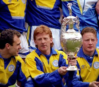 Leeds United captain Gordon Strachan holds the First Division trophy, 1992