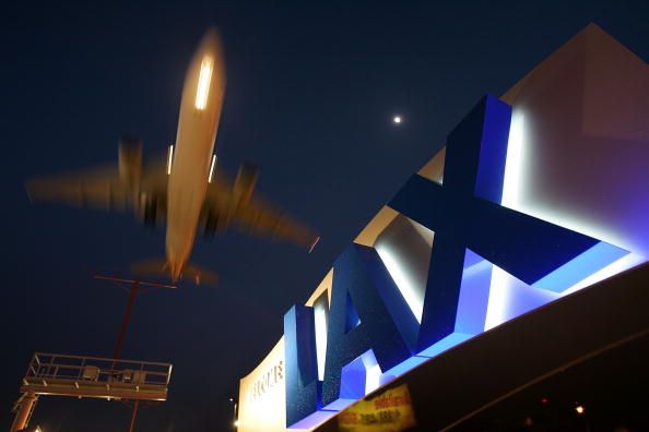 An LAX sign at night.