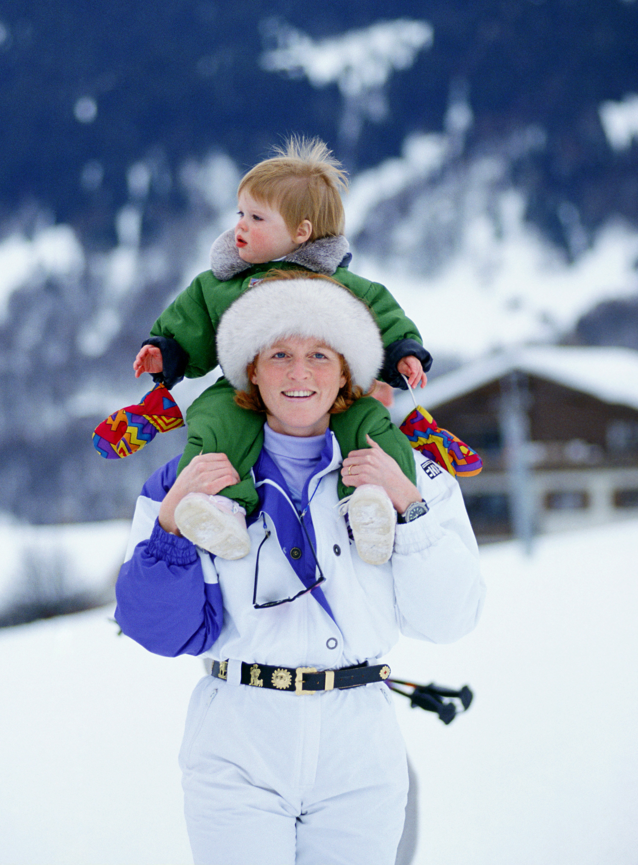 Sarah Ferguson holding Princess Eugenie on a ski trip