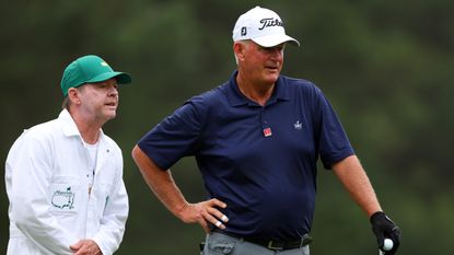Sandy Lyle stands with his caddie during the first round of the 2023 Masters