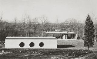 Construction view of the Glass House and Brick House in late 1948, with incomplete interiors