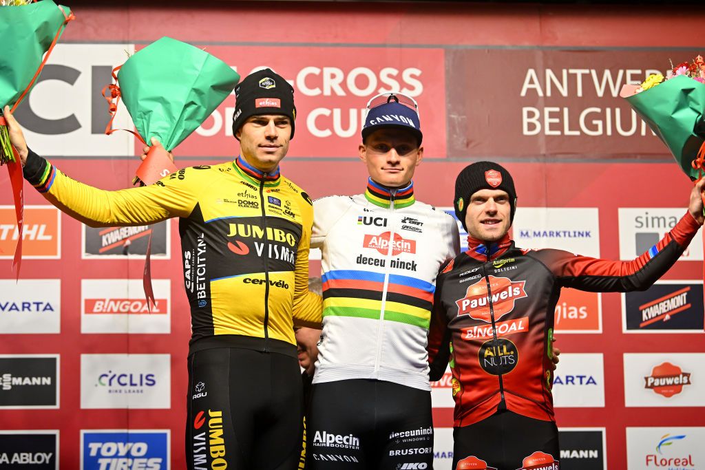 ANTWERP BELGIUM DECEMBER 23 LR Wout van Aert of Belgium and Team JumboVisma on second place race winner Mathieu van der Poel of The Netherlands and Team AlpecinDeceuninck and Eli Iserbyt of Belgium and Team Pauwels Sauzen Bingoal on third place pose on the podium ceremony after the 17th UCI Cyclocross World Cup Antwerpen 2023 Mens Elite on December 23 2023 in Antwerp Belgium Photo by Luc ClaessenGetty Images