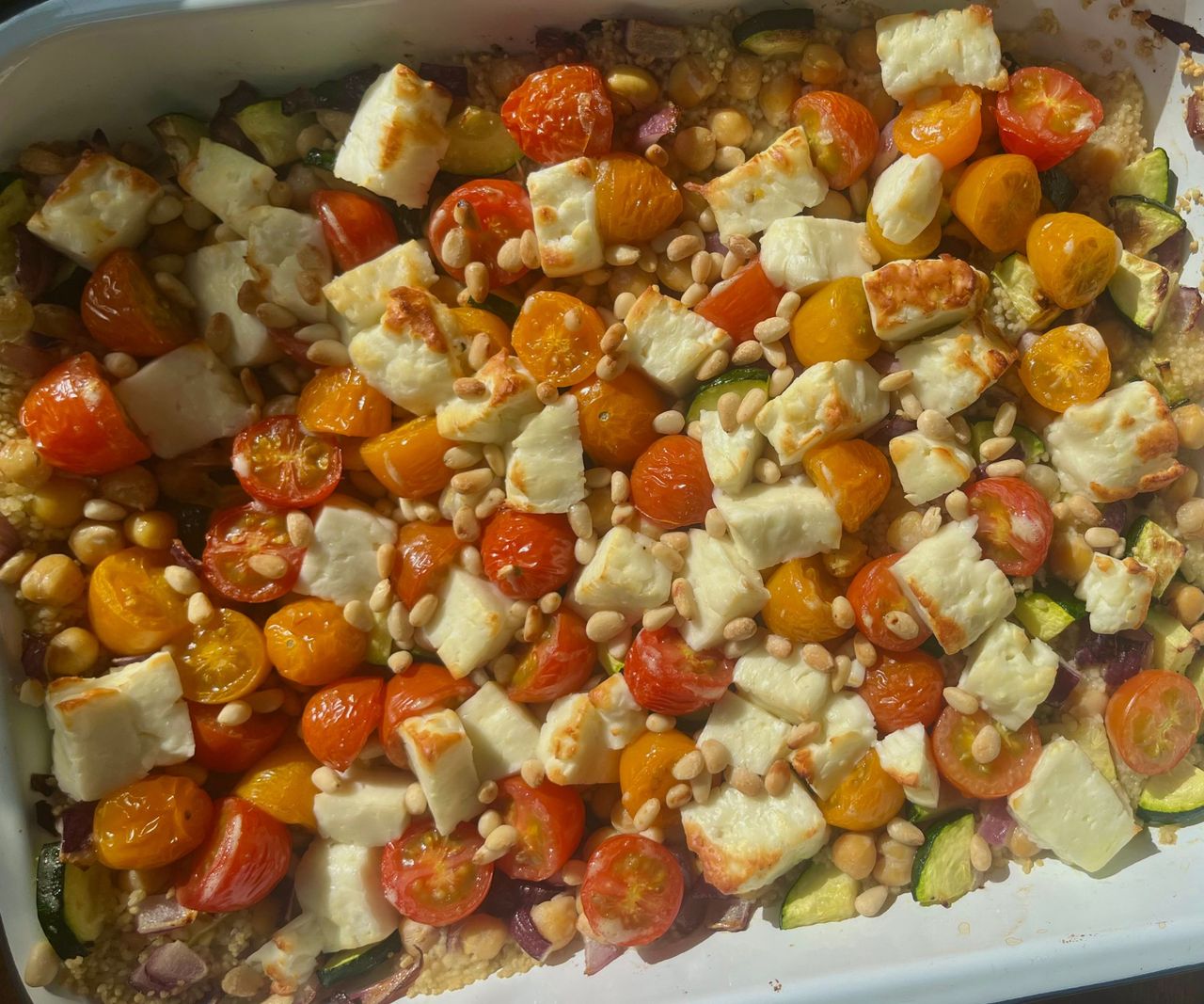 Halloumi, vegetable, and pine nut tray bake