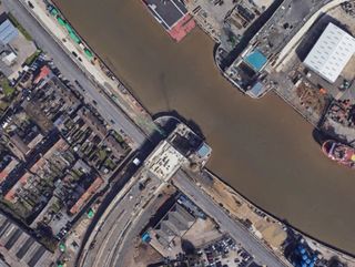 An overhead shot of the Herring Bridge and some local houses