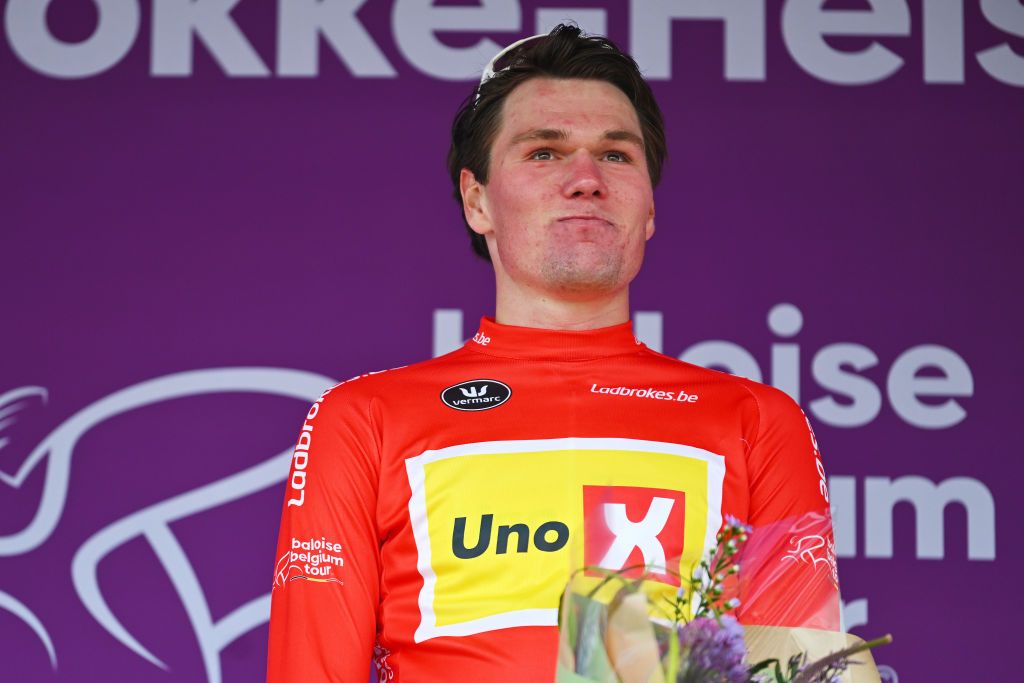 KNOKKEHEIST BELGIUM JUNE 13 Soren Waerenskjold of Norway and Team UnoX Mobility celebrates at podium as Red Points Jersey winner during the 93rd Baloise Belgium Tour 2024 Stage 2 a 1842km stage from Merelbeke to KnokkeHeist on June 13 2024 in KnokkeHeist Belgium Photo by Luc ClaessenGetty Images