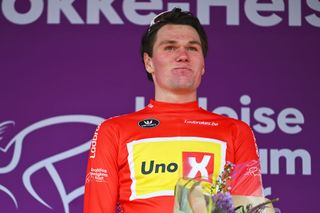 KNOKKEHEIST BELGIUM JUNE 13 Soren Waerenskjold of Norway and Team UnoX Mobility celebrates at podium as Red Points Jersey winner during the 93rd Baloise Belgium Tour 2024 Stage 2 a 1842km stage from Merelbeke to KnokkeHeist on June 13 2024 in KnokkeHeist Belgium Photo by Luc ClaessenGetty Images